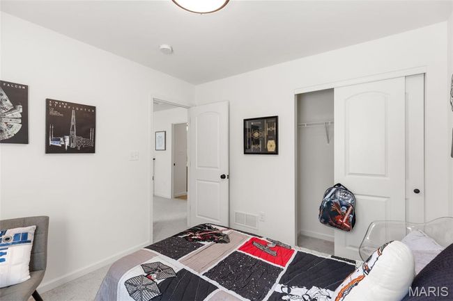 Carpeted bedroom with a closet and baseboards | Image 24