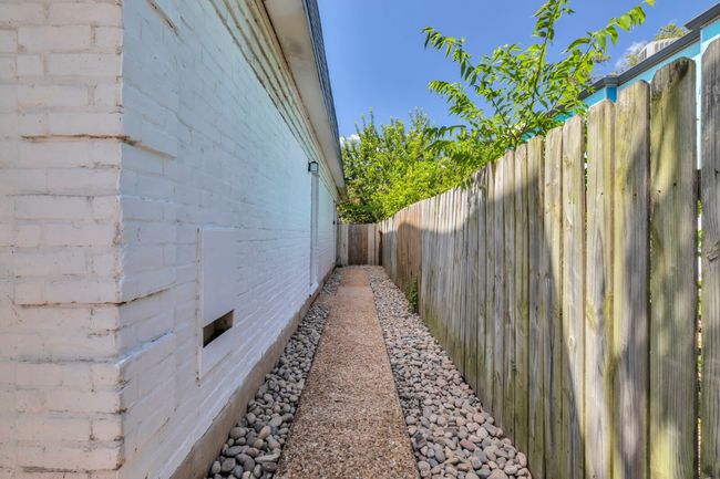 View of home's exterior featuring a fenced backyard | Image 25