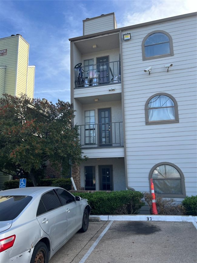 View of building exterior featuring uncovered parking | Image 5