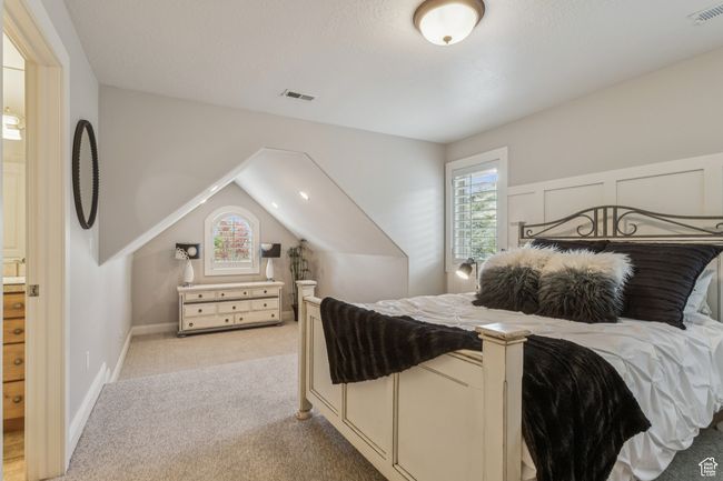Bedroom featuring light carpet | Image 45