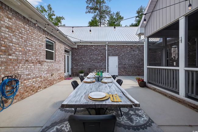 View of patio with outdoor dining area | Image 36