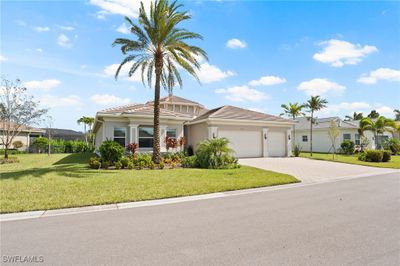 View of front of house with a front lawn and a garage | Image 3