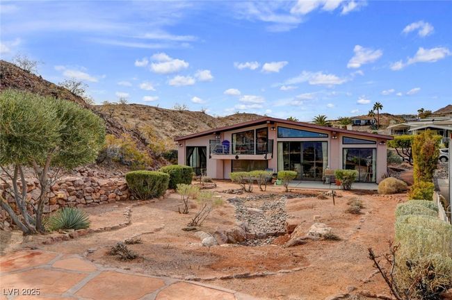 Rear view of property with a patio area and stucco siding | Image 77