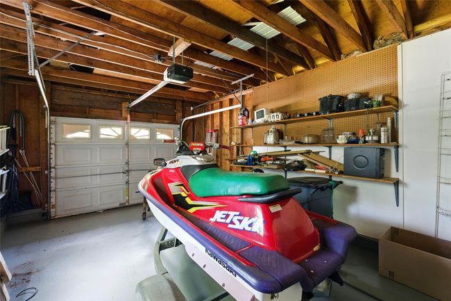 Garage with a garage door opener | Image 38