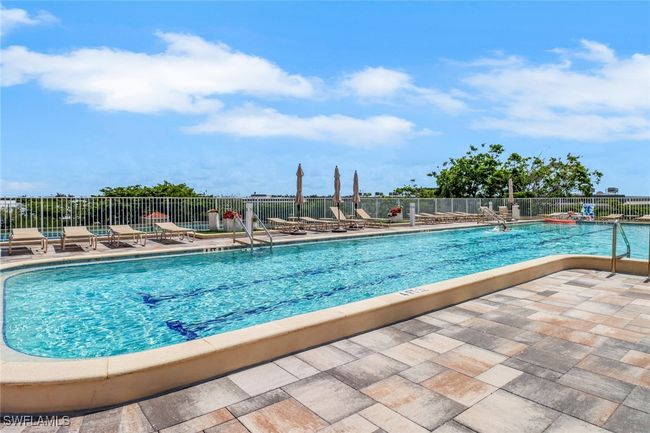 Community pool with a patio | Image 14