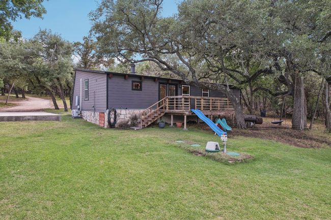 Back of property with a lawn and stairway | Image 30