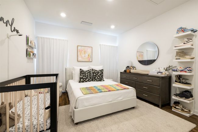 Bedroom with recessed lighting and wood finished floors | Image 15