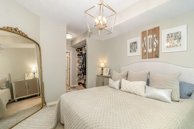 Primary bedroom walks right into a fully custom closet and dressing area! | Image 13