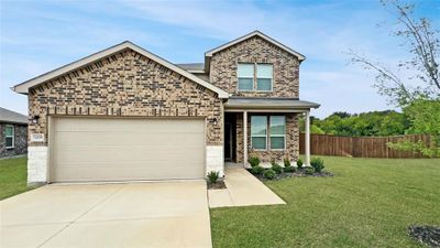 Front view of home with brick and stone facade | Image 1