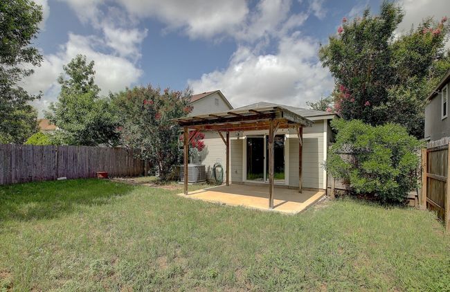 Rear view of property with a pergola, a patio, and central air condition unit | Image 39