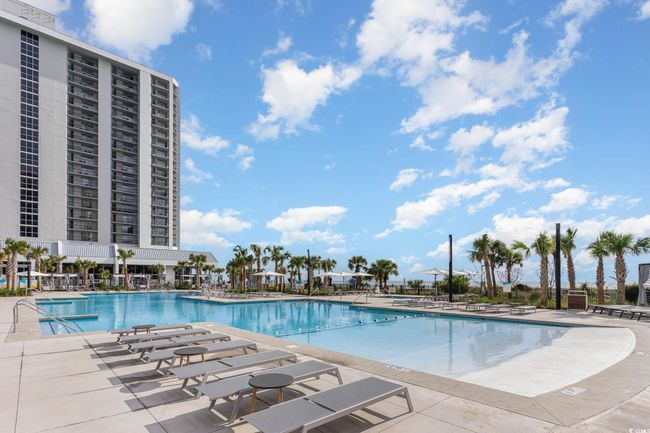 Community pool with a patio area | Image 33