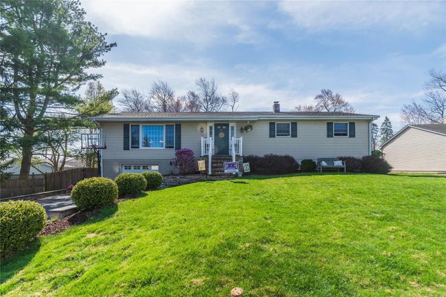 Ranch-style house with a front lawn, fence, and a garage | Image 30