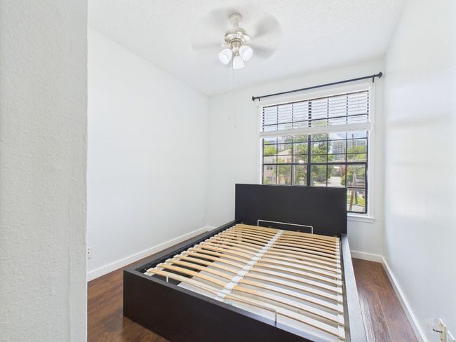 Bedroom with wood finished floors and a ceiling fan | Image 28
