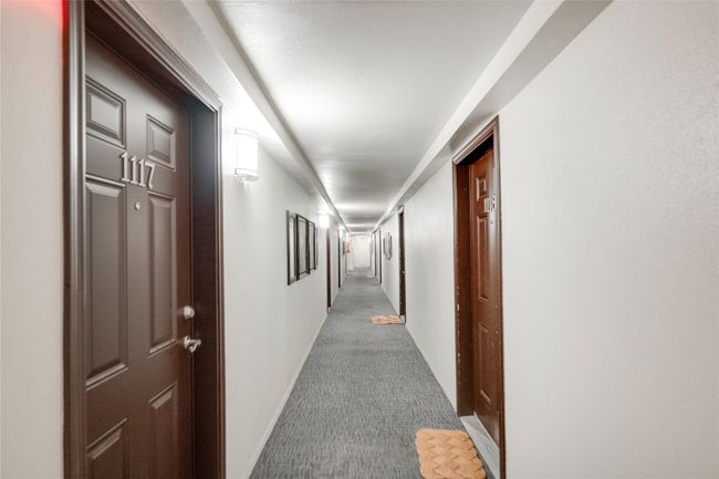 Hall featuring carpet floors and baseboards | Image 20