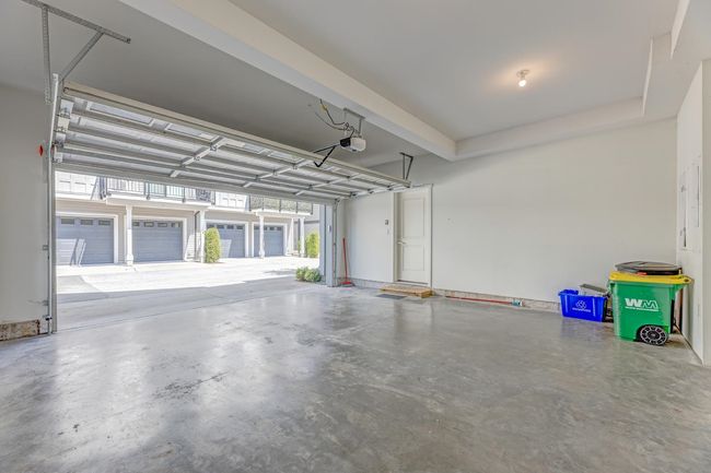 Garage with a garage door opener | Image 36