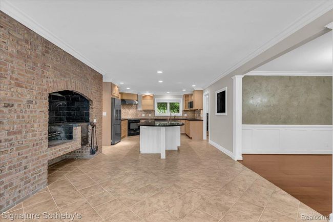 Kitchen with Indoor Grill, Peninsula Island, Granite Counters & Maple Cabinets | Image 15