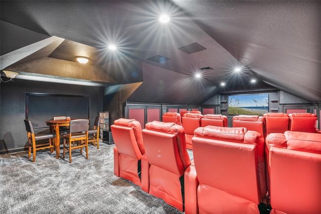 This fully equipped home theater offers tiered seating, immersive acoustics, and a dedicated card and game area—perfect for epic movie nights and casual entertaining. | Image 16