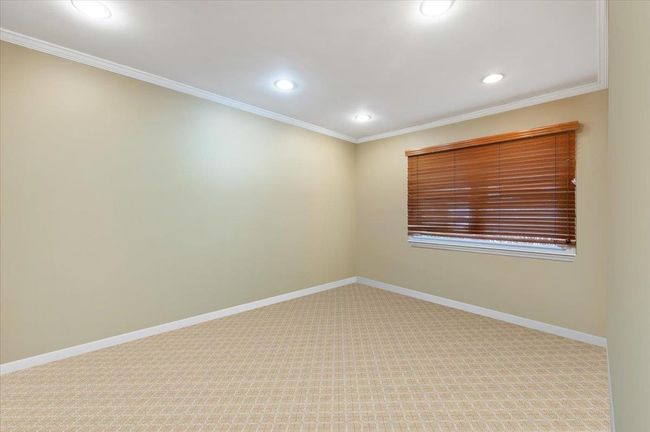Carpeted empty room with recessed lighting, baseboards, and ornamental molding | Image 19