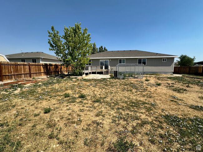 Rear view of house featuring a wooden deck and a fenced backyard | Image 25
