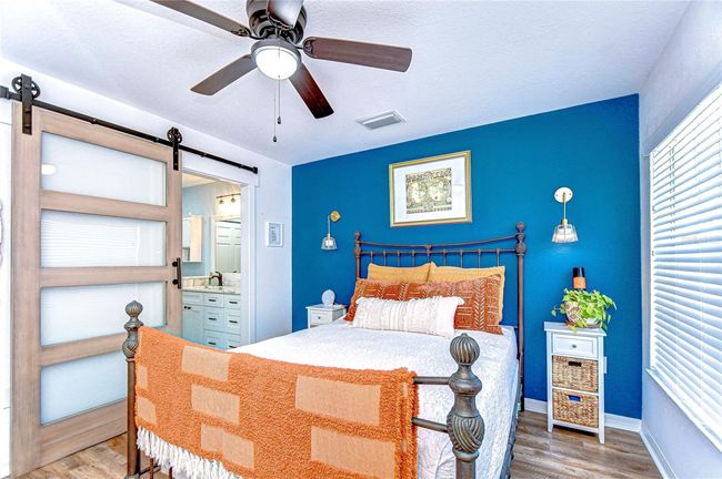 Primary bedroom with ensuite bathoom with Barn door entrance | Image 31