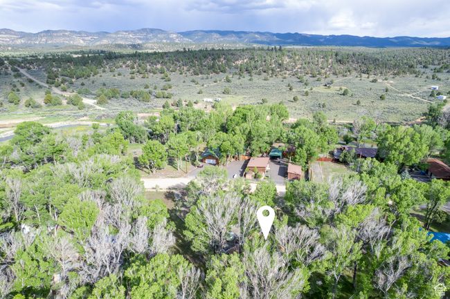 Aerial overview of property's location with a mountainous background | Image 62