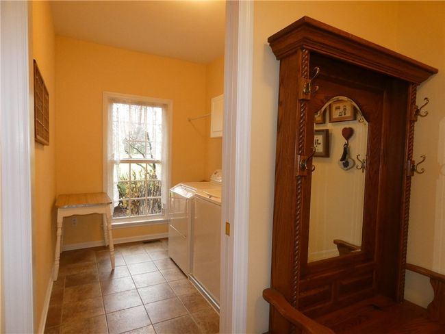 Located off the three-car garage is the mud room/family foyer | Image 25