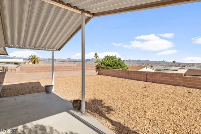 View of yard with a fenced backyard, a patio, and a mountain view | Image 42