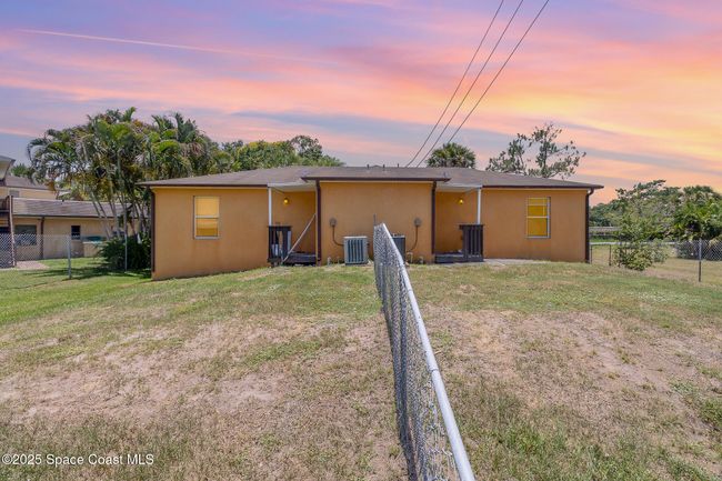 Back of the property. Fenced backyard separating Unit 1230 (left) and unit 1232 (right). | Image 20