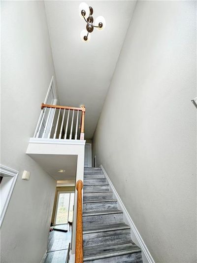 Staircase with wood-type flooring | Image 3