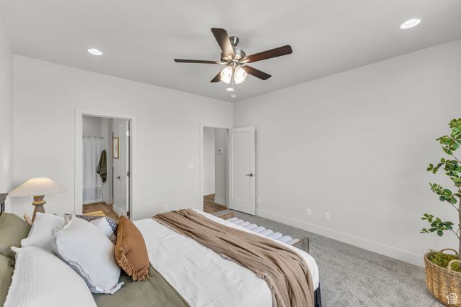 Bedroom with carpet, ceiling fan, and ensuite bath | Image 19