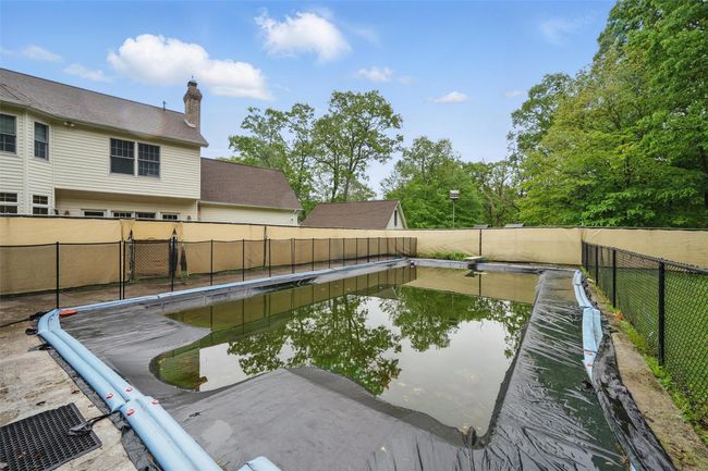 View of pool featuring a fenced backyard | Image 49