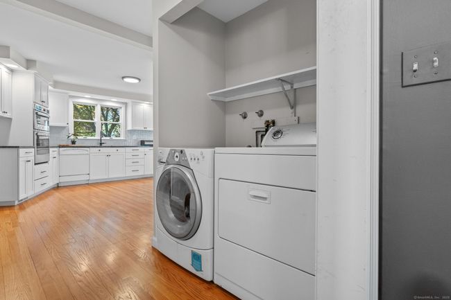 First floor laundry room around the corner from the kitchen. | Image 14
