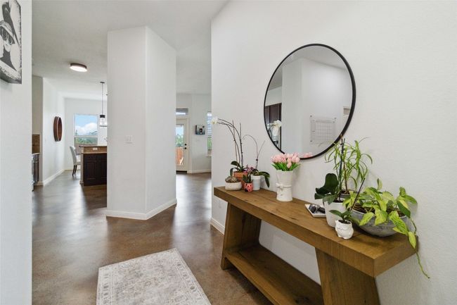 Corridor with finished concrete flooring and baseboards | Image 5