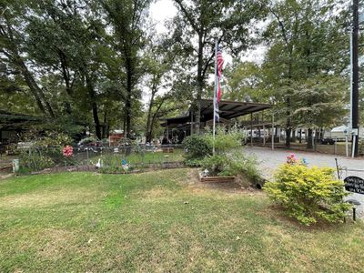 View of yard featuring a carport | Image 3