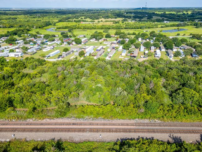 Aerial view of property's location with a nearby body of water | Image 6