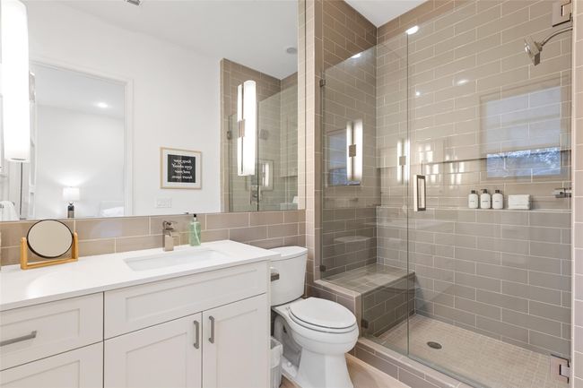 Full bathroom with a shower stall, toilet, and vanity | Image 26