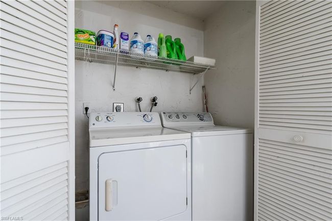 Washroom featuring laundry area and washer and clothes dryer | Image 24