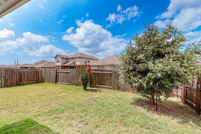 View of fenced backyard | Image 38