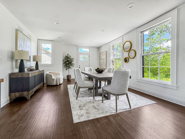 The kitchen opens to a spacious family room and br | Image 22