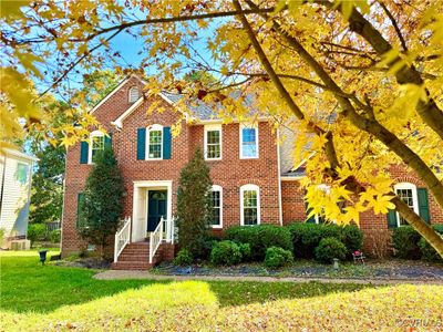 View of front of house with central air condition unit and a front lawn | Image 2