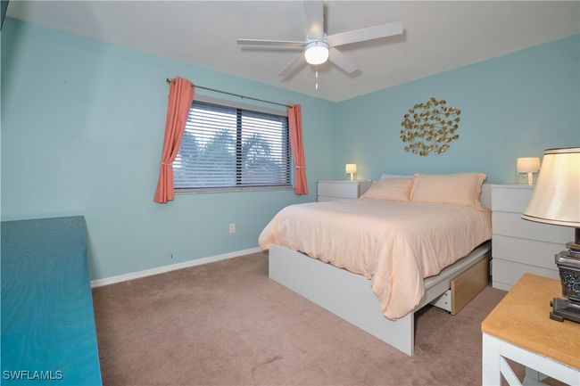 Bedroom featuring carpet floors and ceiling fan | Image 25