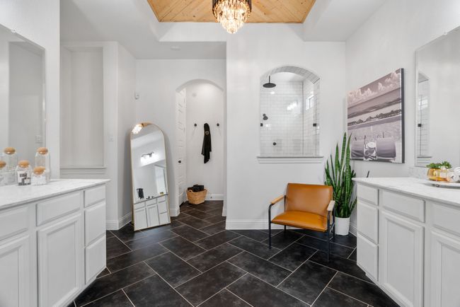 Full bath with walk in shower, vanity, wooden ceiling, a chandelier, and baseboards | Image 17