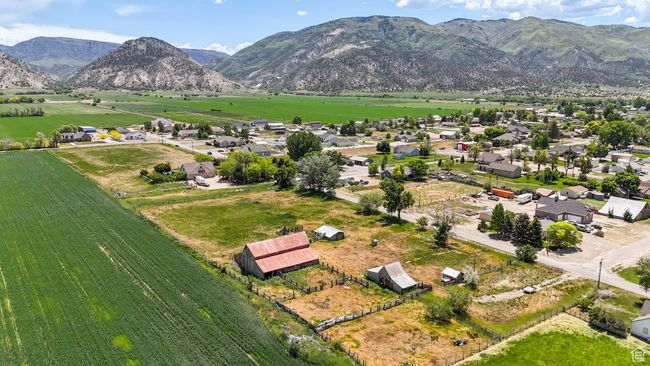 Aerial view of sparsely populated area with a mountain backdrop | Image 6