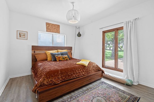 Bedroom featuring wood finished floors and baseboards | Image 28