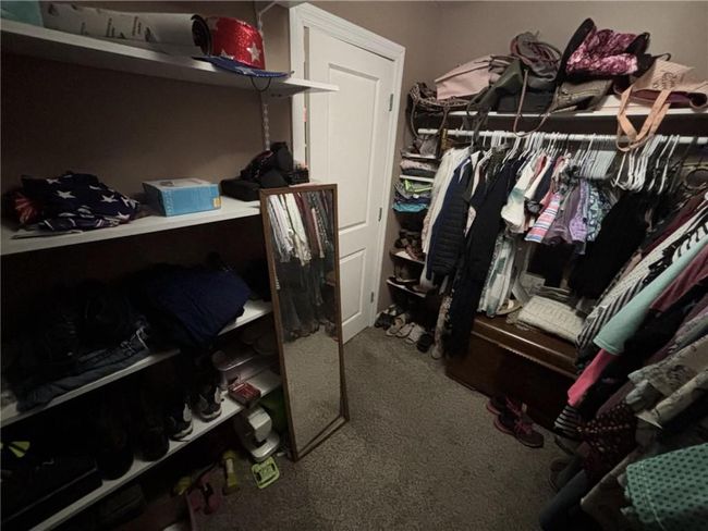 Walk in closet with carpet flooring | Image 31
