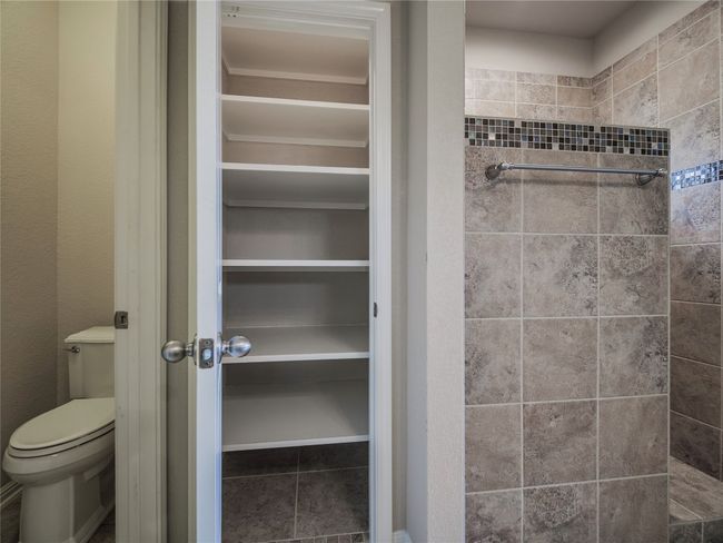 Full bathroom with toilet and a shower | Image 29