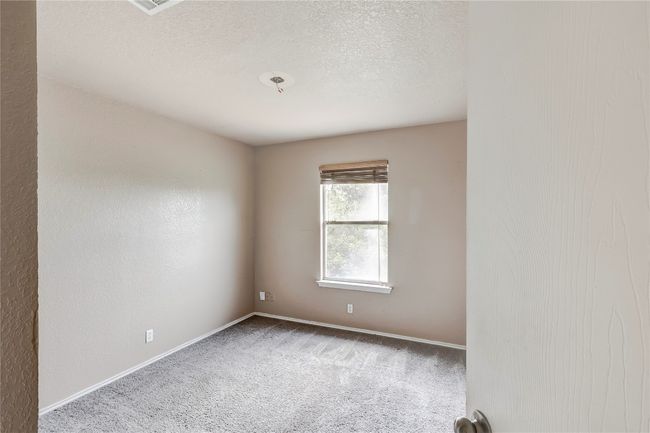 Carpeted spare room with a textured ceiling | Image 17