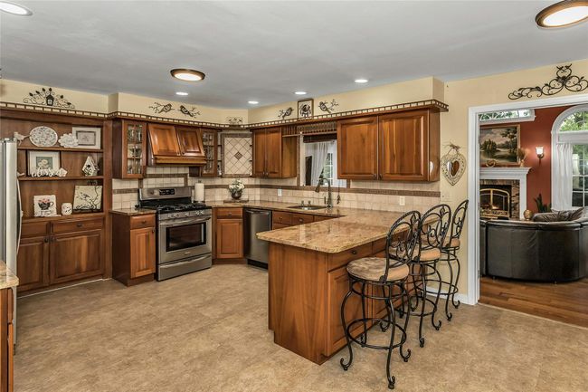 Updated and Open Kitchen Area Leading to the Great Room | Image 7