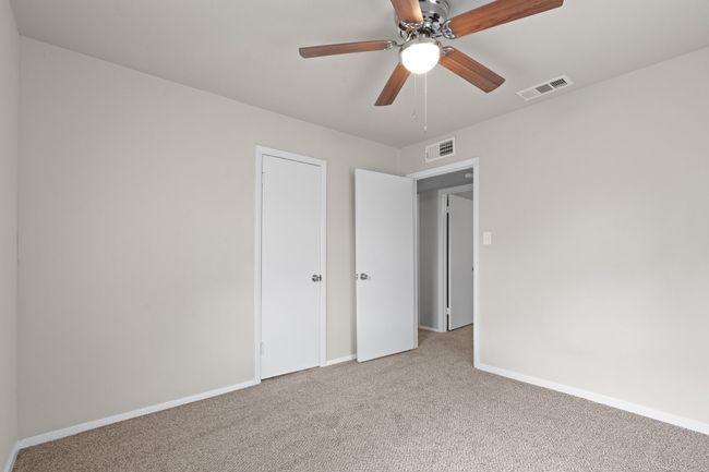 Unfurnished bedroom featuring carpet floors and a ceiling fan | Image 16