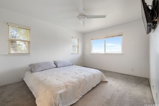 Appreciate the privacy & quietness added by the palms outside your bedroom window. | Image 13
